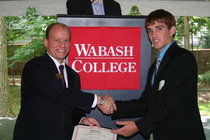 a man shaking hands with another man
