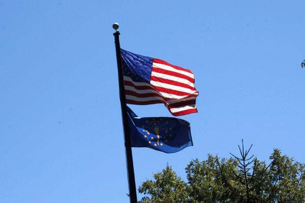 a flag and flagpole with a flag on it