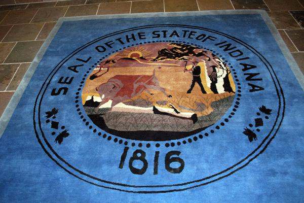a blue rug with a seal on it
