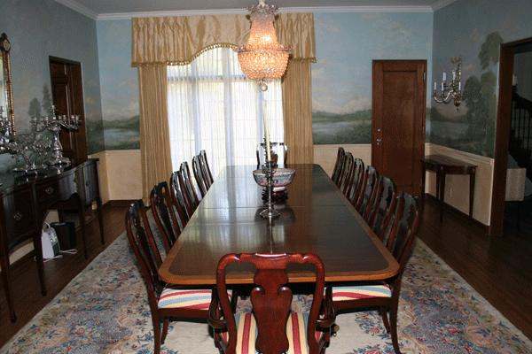 a dining table with chairs and chandelier