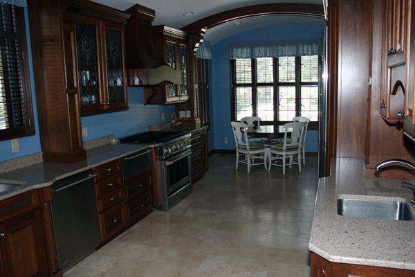 a kitchen with a table and chairs