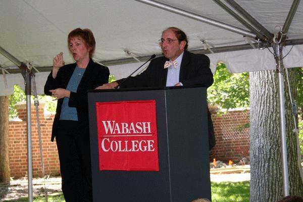 a man and woman standing at a podium