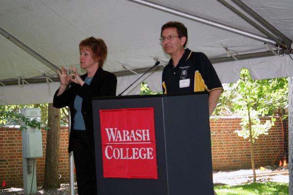 a man and woman standing at a podium
