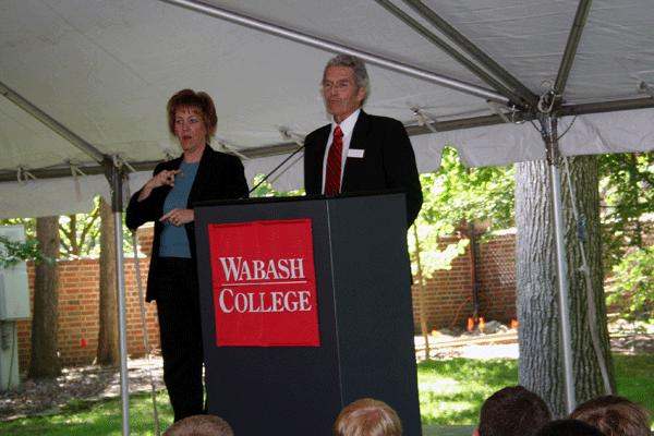 a man and woman standing at a podium