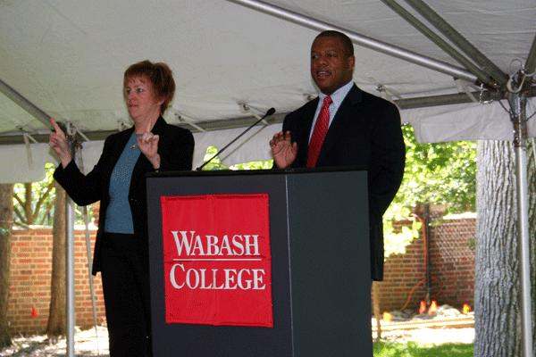 a man and woman standing at a podium