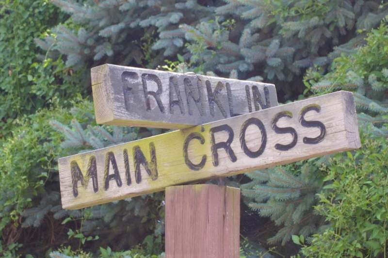 a wooden sign with a couple of words