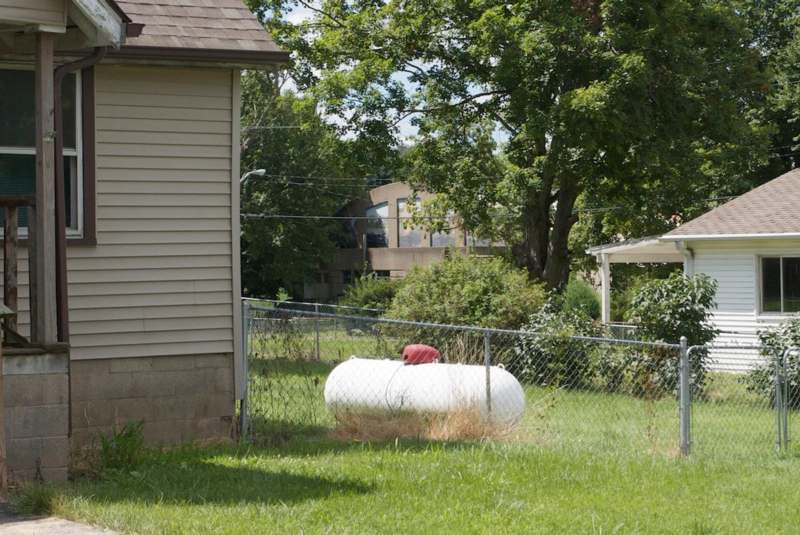 a white tank in a yard