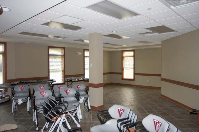 a room with chairs and tables