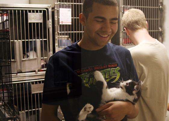 a man holding a cat