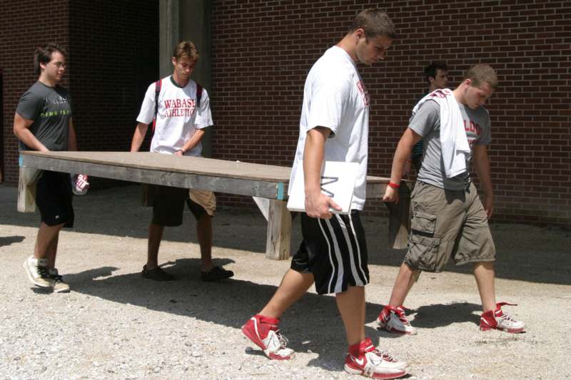 a group of young men walking outside