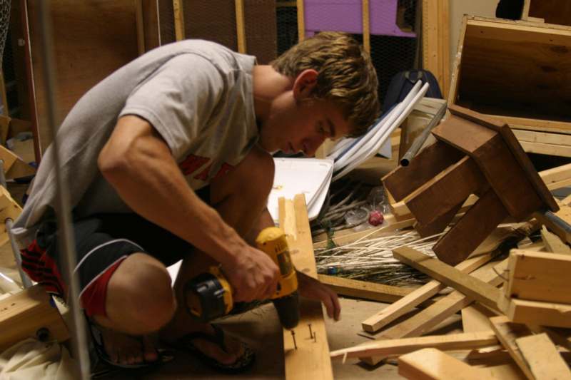 a man using a drill to drill wood
