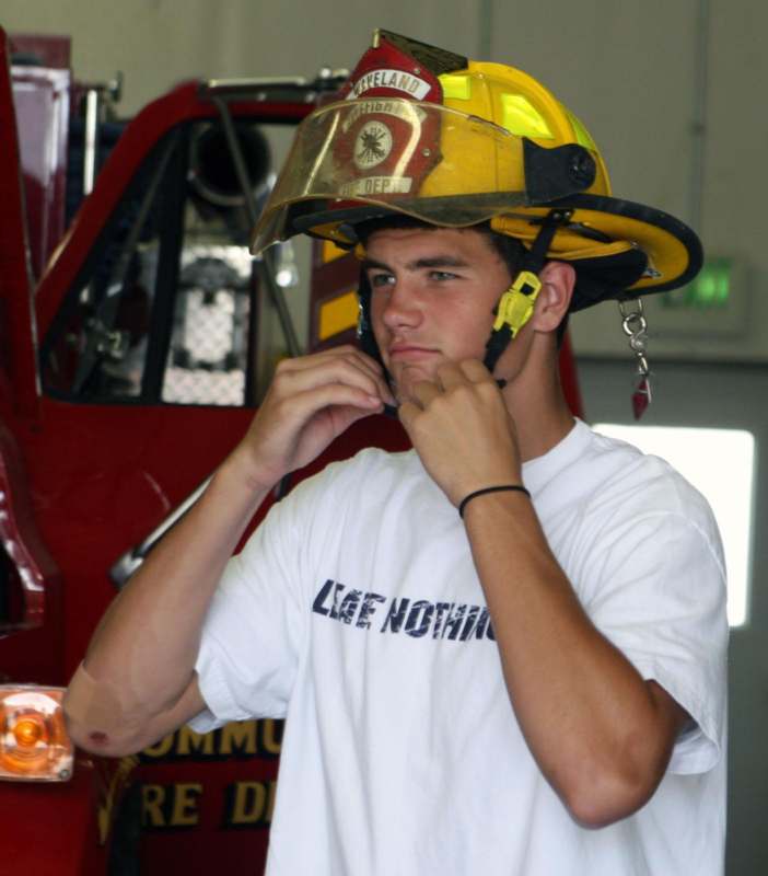 a man wearing a firefighter helmet