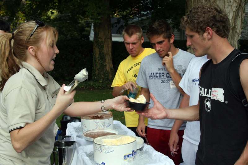 a group of people eating cake