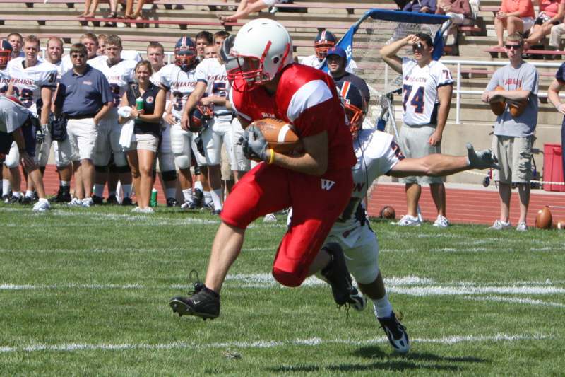 a football player running with the ball