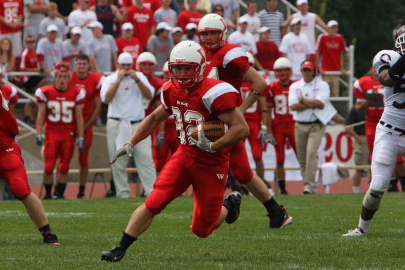 a football player running with a ball