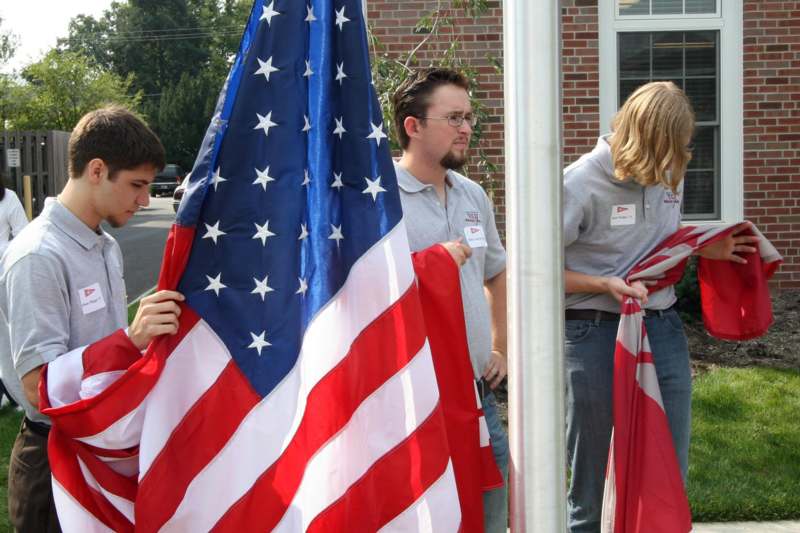 a group of people holding a flag