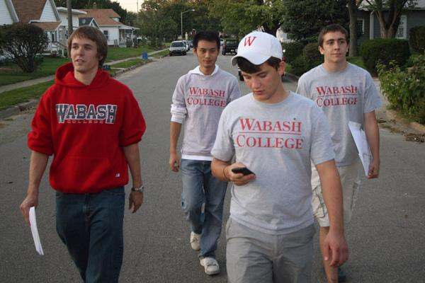 a group of young men walking down a street