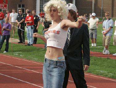 a man in a wig standing on a track