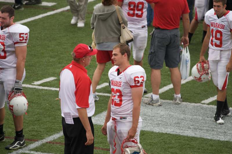 a football player talking to another football player