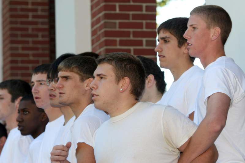a group of young men standing in a row