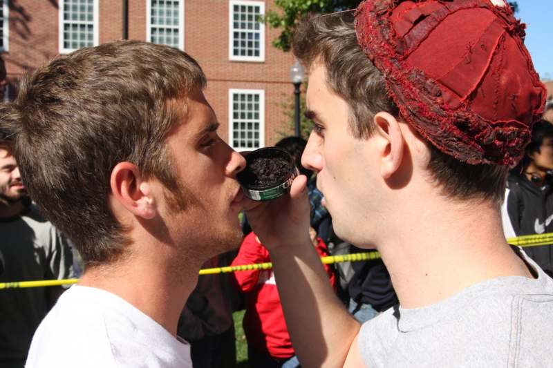 a man kissing another man's nose