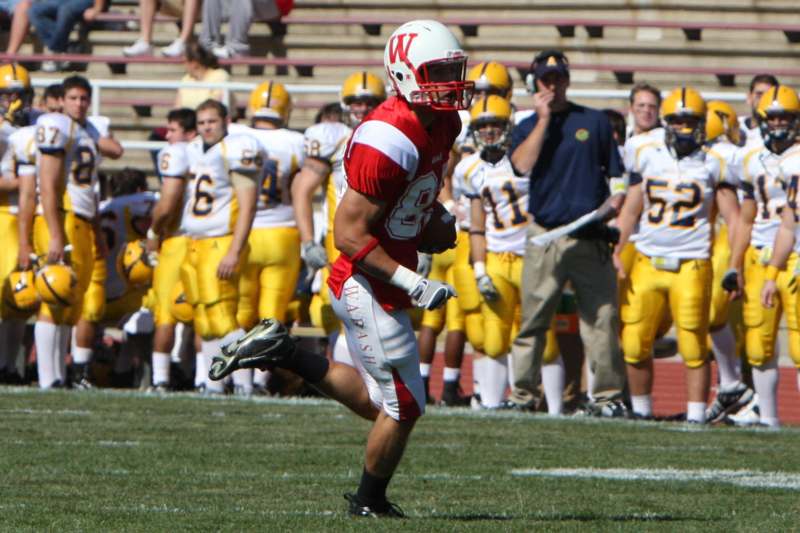a football player running on a field
