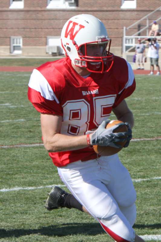 a football player holding a football