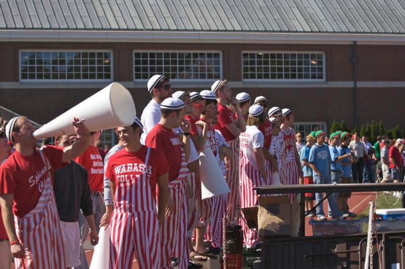 a group of people wearing striped outfits