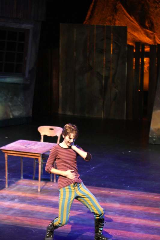 a boy dancing on a stage