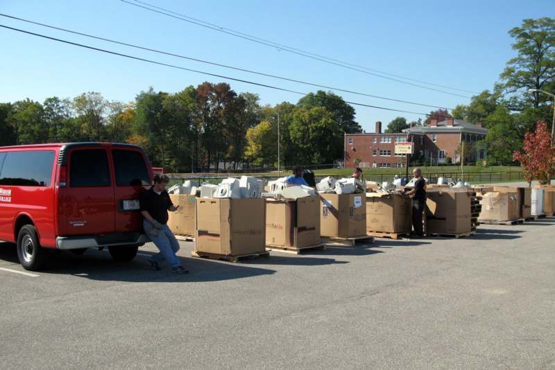 several people loading boxes