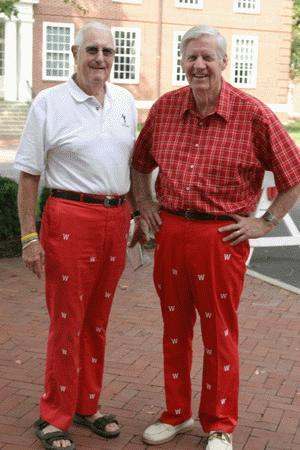 a pair of old men wearing red pants