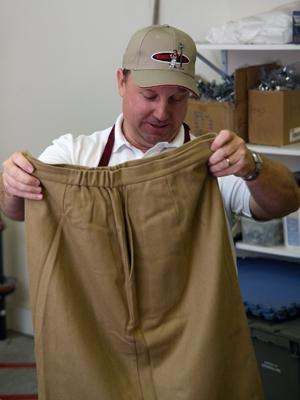 a man holding a pair of pants