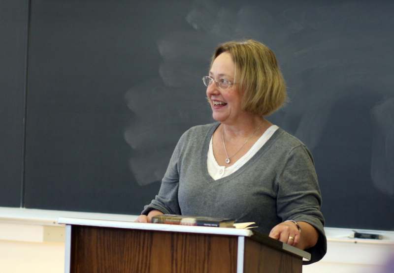 a woman standing at a podium