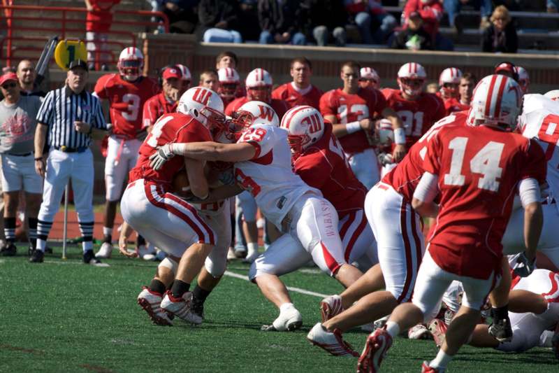 a football players in red and white uniforms