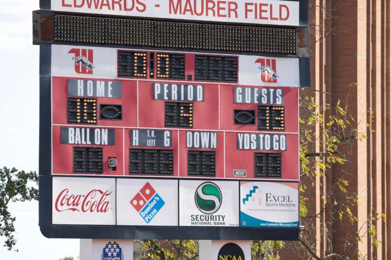 a scoreboard with numbers and letters on it