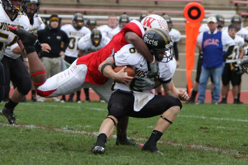 a football player being tackled by another football player