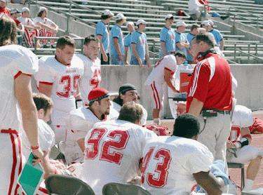 a football coach talking to his players