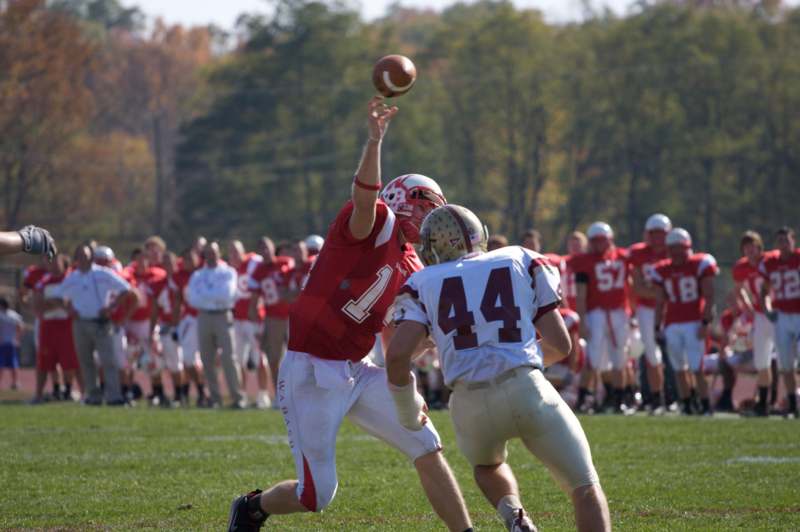 a football player reaching for a football