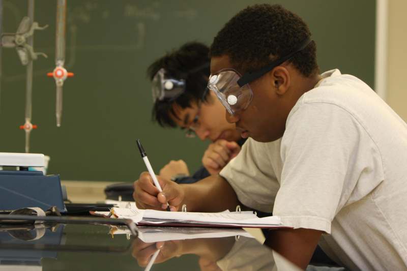 a group of students wearing safety goggles