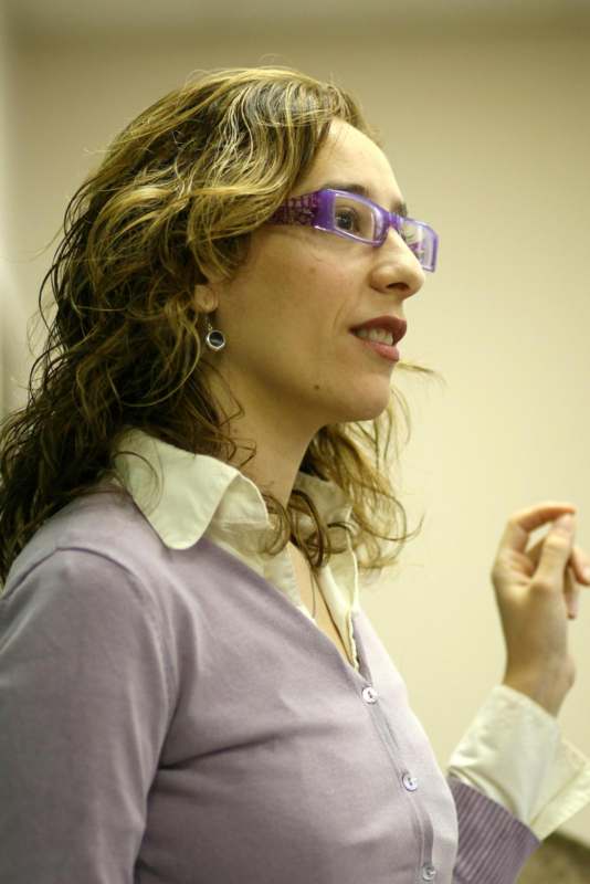 a woman wearing purple glasses