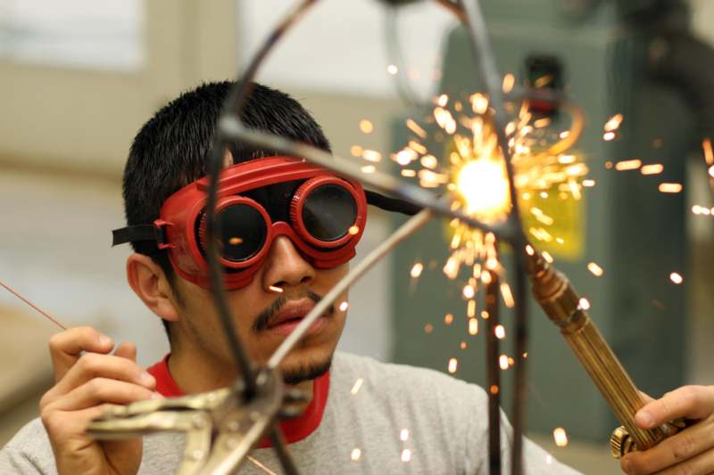 a man wearing goggles and welding glasses