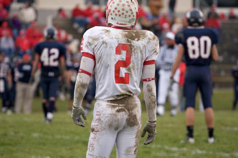 a football player in a dirty uniform