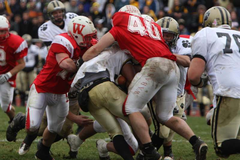 a group of football players in a fight