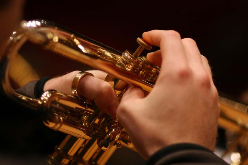a person playing a trumpet
