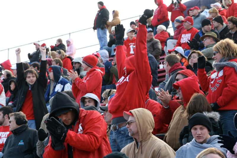 a crowd of people in red jackets