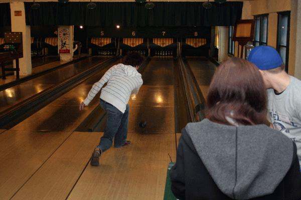 a person bowling on a bowling lane