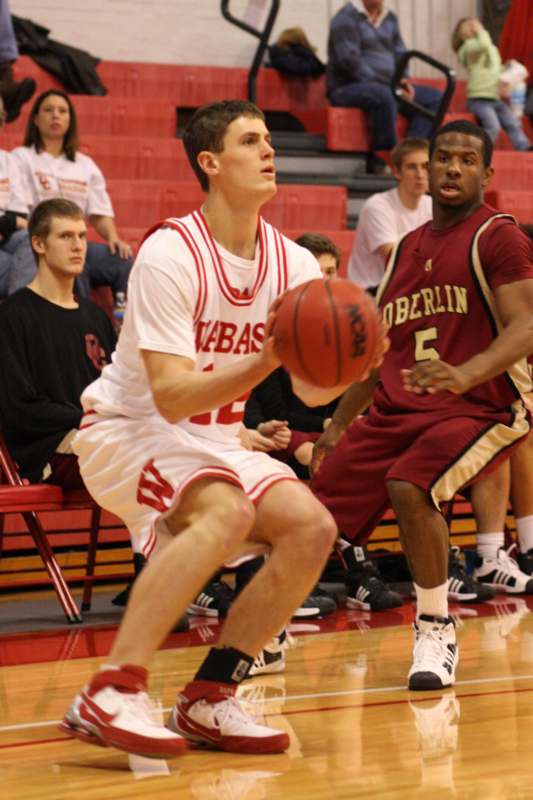 a basketball player in a red uniform with a ball in his hand