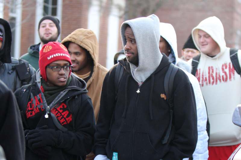 a group of people in hoodies