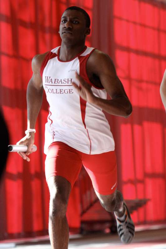 a man running in a track and field uniform