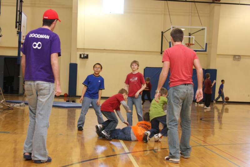 a group of kids playing in a gym